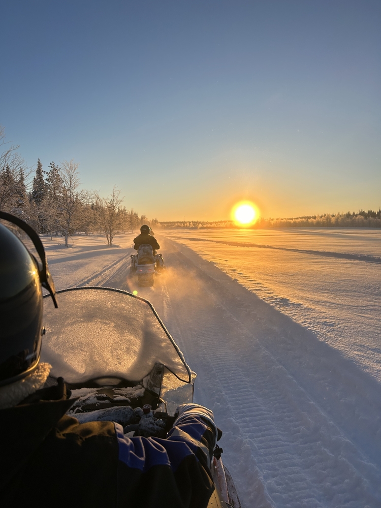Watching,The,Sunrise,Whilst,On,A,Snowmobile,Safari,In,Finnish